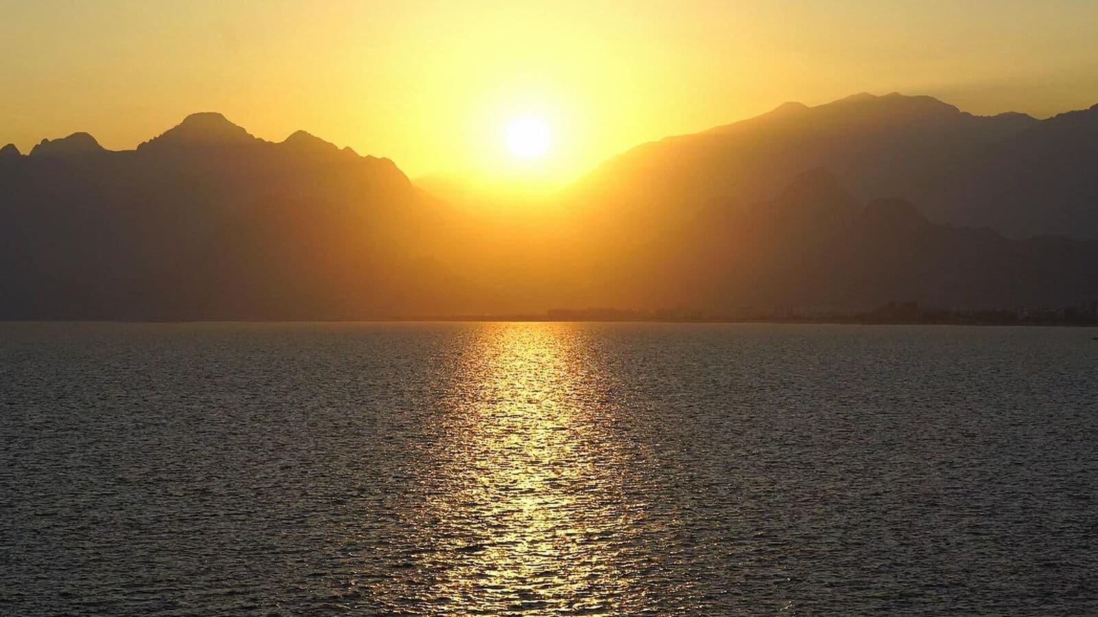Sunrise over calm mountains